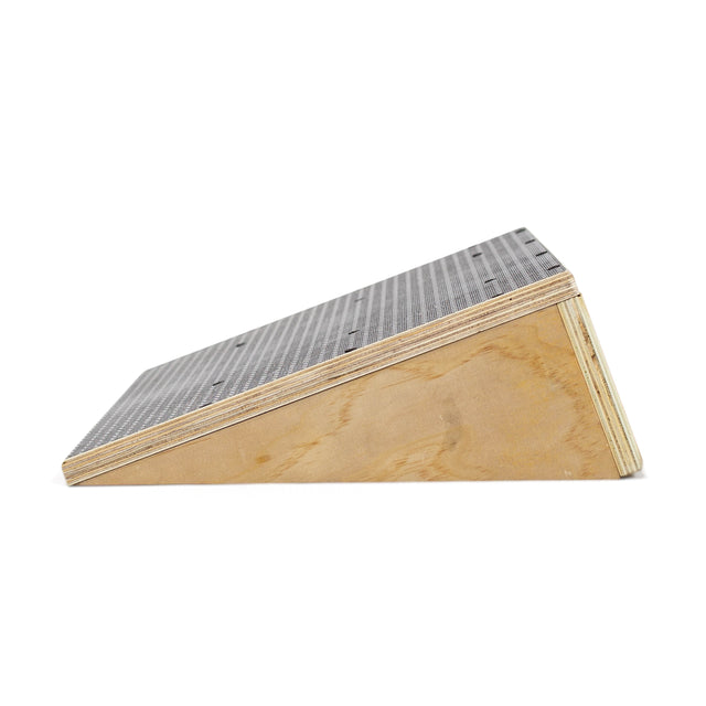 The Bells of Steel Squat Wedge Board, shown from the side against a white background, features a textured dark top—perfect for enhancing ankle mobility and squat depth.