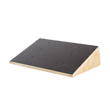 The Bells of Steel Squat Wedge Board features a black textured surface and exposed plywood edges, designed to enhance squat depth or ankle mobility, shown on a white background.