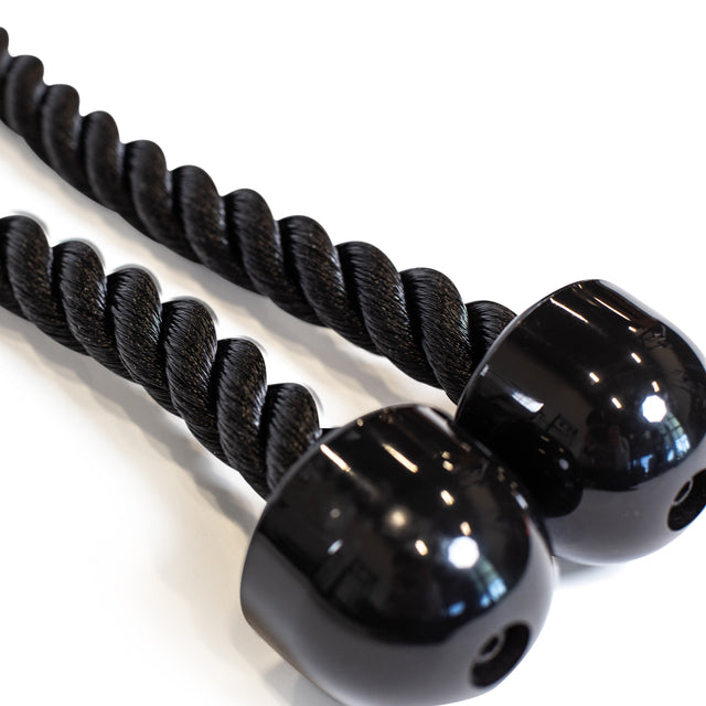 Close-up of the Bells of Steel Extra Long Tricep Rope Extension (137cm), featuring two black twisted ropes with glossy, rounded end caps, designed as a cable attachment for tricep pushdowns and shown on a white surface.