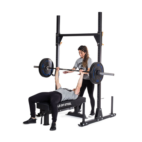 Athletes demonstrating flat bench press using Strongman Yoke