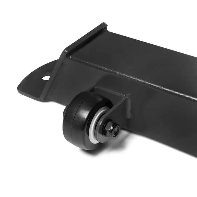 Close-up of a black metal bracket with a small black caster wheel, made for the Bells of Steel Buzz-Saw Heavy-Duty Adjustable Bench, isolated on a white background.