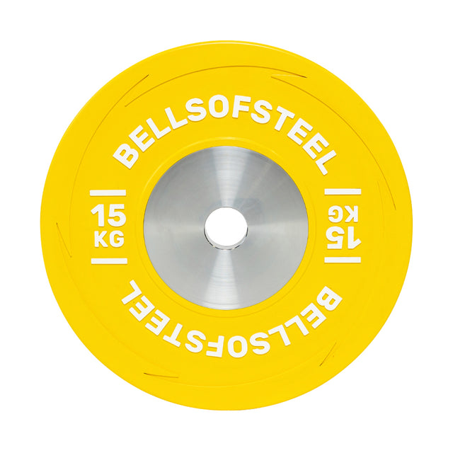 A vivid yellow Boltless KG Competition Bumper Plate from Bells of Steel, labeled "15 KG" in white, features a metallic center hole for Olympic lifts and is built to IWF specifications.