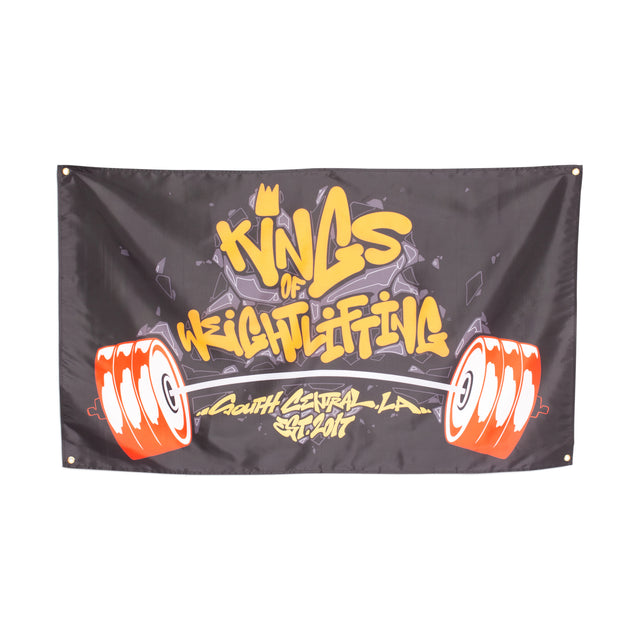 The Bells of Steel Flags feature "Kings of Weightlifting, South Central, LA, Est. 2017." in yellow and white graffiti letters with red and white barbells—an eye-catching decor choice for any gym or home workout space.
