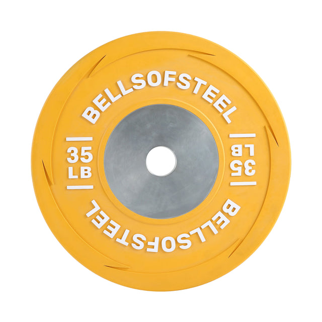 A yellow 35-pound Boltless LB Competition Bumper Plate by Bells of Steel, with "BELLSOFSTEEL" and "35 LB" in white around the center hole, crafted to IWF specs for Olympic lifting and viewed from above.