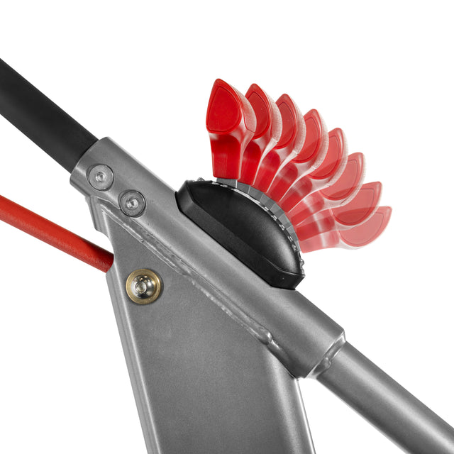 Close-up of the Bells of Steel Sisyphean Stepper's metallic mechanism with a black dial and red handles, showing adjustable resistance levels on this manual stair climber.