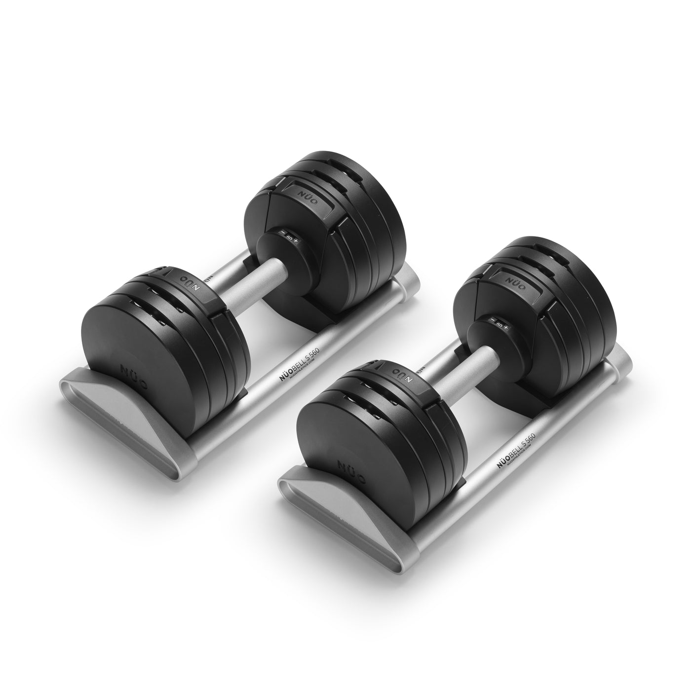 Two NÜOBELL-S Adjustable Dumbbells by Bells of Steel USA, featuring clear weight markings, rest on sleek silver stands against a white background—an ideal home gym addition.