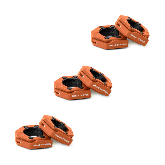Three pairs of orange, octagonal Magnetic Clamp Collars by Bells of Steel are stacked diagonally on a white background, with each pair's collars slightly tilted and resting on one another.
