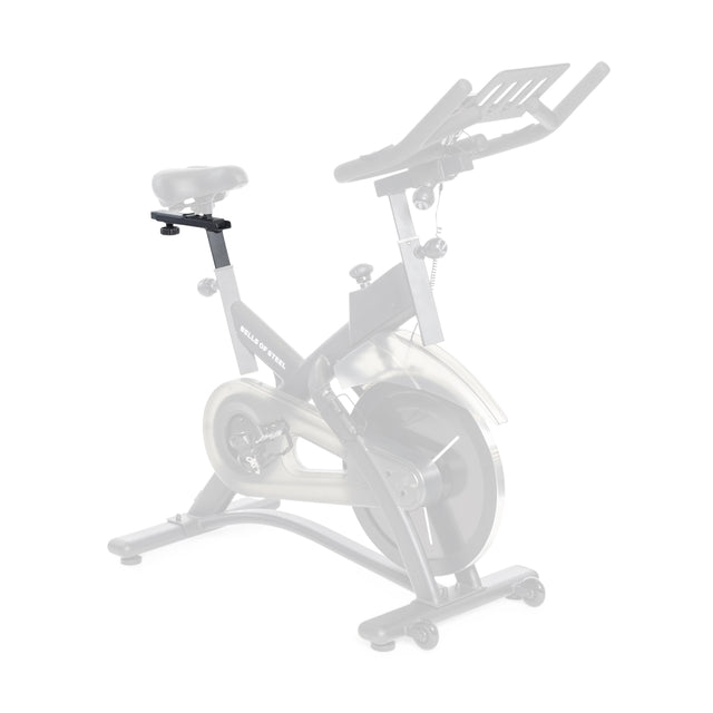 The Bells of Steel USA Tall Cycling Bike Seat Post is shown installed on a stationary bike, making the seat noticeably higher than the original base model, which appears faded in the background for contrast.