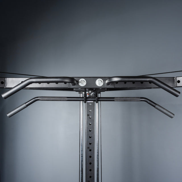 Close-up of the Bells of Steel All-in-One Trainer’s pull-up bar, mounted on the rack with multiple grip options for versatile exercises—ideal for home gyms—set against a plain gray background.