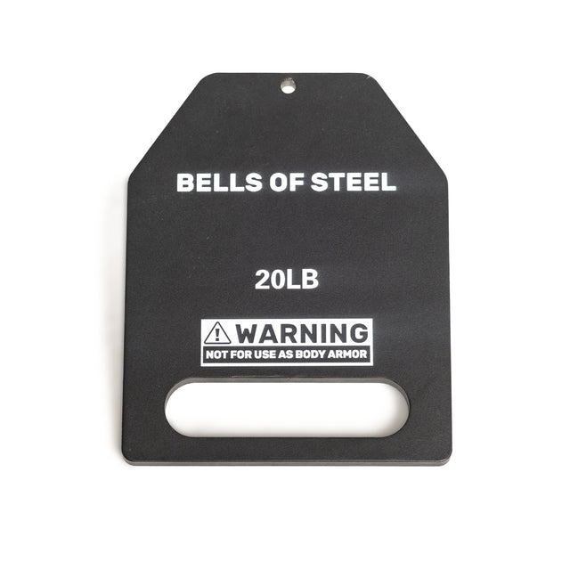 The black Bells of Steel USA 20LB weight plate features a bottom handle cutout and a small top hole for hanging. Designed for use with weighted vests, it includes the warning "NOT FOR USE AS BODY ARMOR.