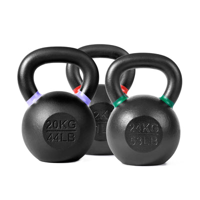 Three black kettlebells are displayed, marked with 20 kg (44 lb), 24 kg (53 lb), and another slightly obscured weight. Each has a colored stripe on the handle for easy identification.