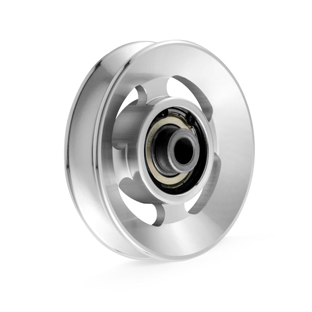 The Aluminum Pulley Wheels & Upgrade Kits by Bells of Steel feature a sleek aluminum design with smooth silver surface and central bearing. Circular cutouts offer a modern, industrial look, perfect for cable machines, showcased against a plain white background.