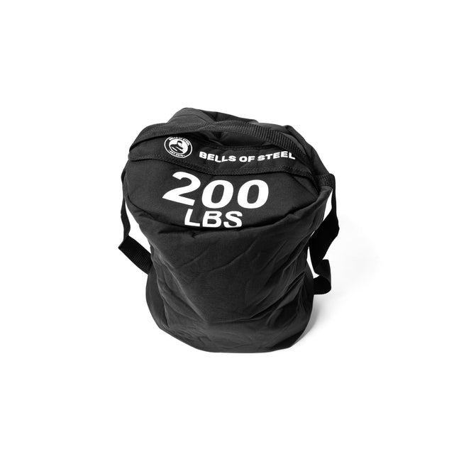 A large black Fitness Sandbag branded with "Bells of Steel" and "200 LBS" printed in white letters is shown against a plain white background. It features sturdy handles and a rugged texture, showcasing its durable Condura construction.