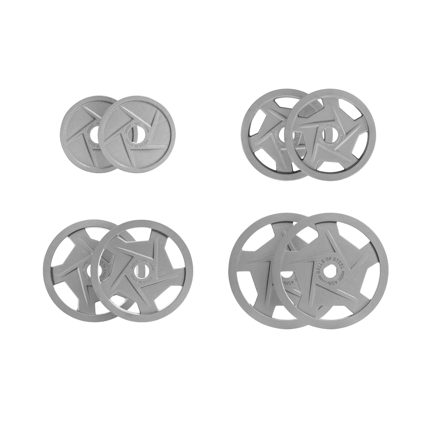 Four pairs of Bells of Steel's Gray Mighty Grip Olympic Weight Plate Sets are arranged with two smaller plates top left, a medium pair top right, slightly larger bottom left, and largest bottom right, all featuring circular holes and ergonomic design for easy handling.