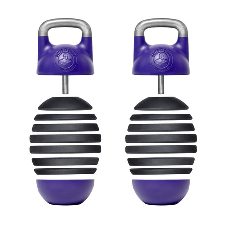 Two shaker instruments in purple and black, featuring ergonomic handles and ribbed designs that evoke the Adjustable Competition Kettlebell from Bells of Steel. Equipped with metallic loops on top for easy gripping, these vertically aligned shakers showcase a modern design perfect for musical use.