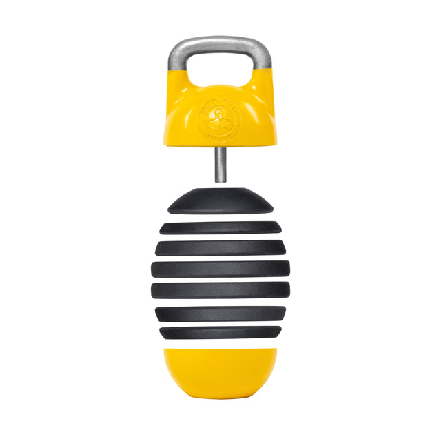 The Bells of Steel Adjustable Competition Kettlebell is a yellow and black handheld percussion instrument with a striped design, featuring a metal handle on top. It resembles an egg maraca and includes a circular grip for easy handling.