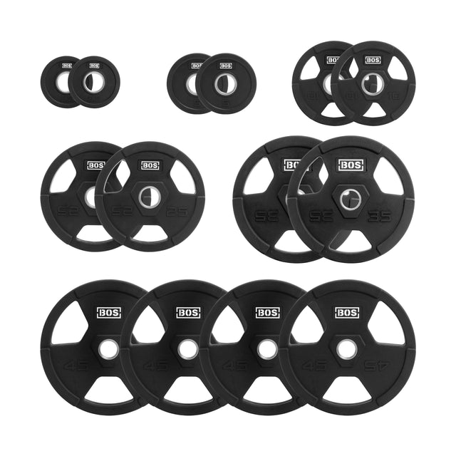 Arranged on a white background, the Bells of Steel Rubber Coated Iron Weight Plates come in various sizes. These black plates have small triangular cutouts, ergonomic handles, and feature the "BOS" logo printed in white.