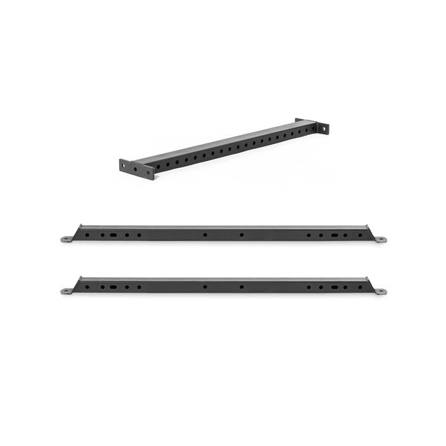 The image features the Bells of Steel Hydra Flat Foot Components—a black, rectangular metal rackmount bracket for Hydra power racks—shown from three angles, each displaying multiple holes for mounting to a flat foot support system.