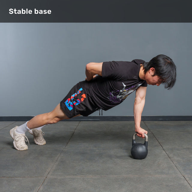 Balancing in a plank position, an individual supports their body with one hand on the Bells of Steel 6-12KG Adjustable Kettlebell while resting the other hand on their back. The phrase “Stable base” appears at the top left.
