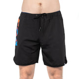 A person is wearing Bells of Steel's Gym Shorts, featuring a black design with colorful geometric patterns on the side. Made of high-performance polyester with a drawstring waist, these stretchy shorts reach just above the knees against a plain white background.