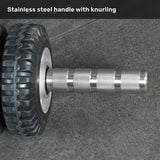Close-up of the ABsyidyan Stainless Steel Ab Roller by Bells of Steel USA, featuring a knurled stainless steel handle and extra-wide dual wheels on a textured gray surface. Text above: "Stainless steel handle with knurling.