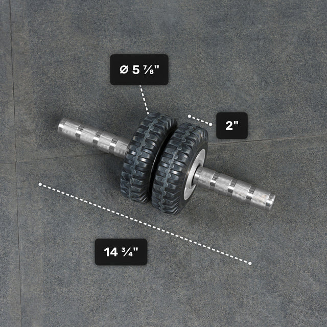 The ABsyidyan Stainless Steel Ab Roller by Bells of Steel USA features extra-wide dual wheels (5 5/8" diameter, 2" width), a 14 3/4" handle, supports up to 500 lbs, and is shown on a gray surface.