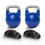 Two Bells of Steel Adjustable Competition Kettlebells with silver handles stand behind a set of black circular weight plates, all arranged on a white background.