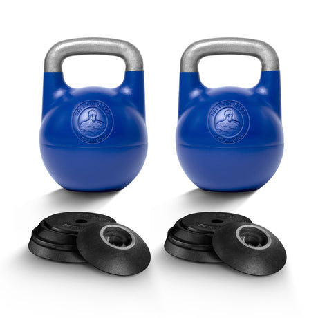 Two Bells of Steel Adjustable Competition Kettlebells with silver handles stand behind a set of black circular weight plates, all arranged on a white background.