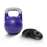 A Bells of Steel Adjustable Competition Kettlebell with a silver handle is positioned beside four stacked black weight plates on a white background.