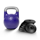 A Bells of Steel Adjustable Competition Kettlebell with a silver handle is placed beside a stack of black, round weight plates on a white background.