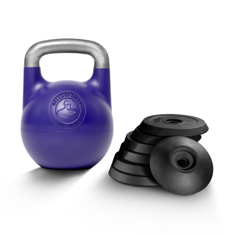 A Bells of Steel Adjustable Competition Kettlebell with a silver handle is placed beside a stack of black, round weight plates on a white background.