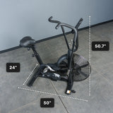 A Bells of Steel Residential Air Bike with Wind Guard, in black, stands on a gray tiled floor—ideal for home gyms. Dimensions: 24-inch seat height, 50-inch base length, and 50.7-inch handlebar height are shown.