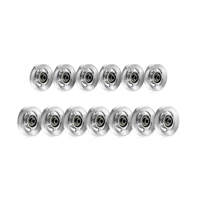 Two neat rows feature 14 identical Bells of Steel Aluminum Pulley Wheels. Each wheel, part of their Upgrade Kits, has a shiny silver exterior with a visible central bearing and is evenly spaced on a plain white background.