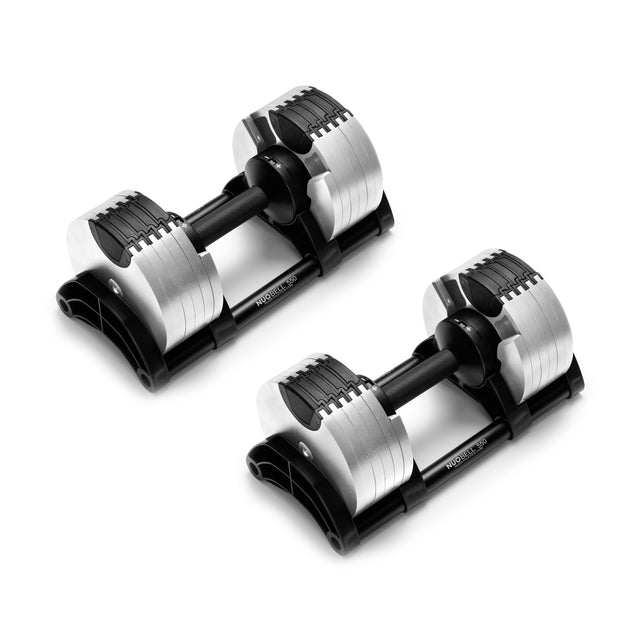 The NÜOBELL Adjustable Dumbbells by Nuobell are shown on a white background, featuring sleek machined steel weight plates and black knurled handles, portraying a modern and versatile fitness accessory.