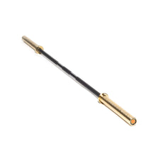 The Bells of Steel Alex Leonidas Onyx Bar, a black and gold Olympic weightlifting barbell with a Cerakote finish, is shown from a diagonal angle isolated on a white background.