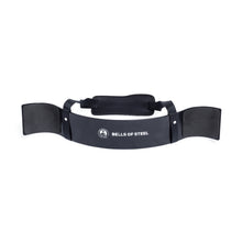 The Bells of Steel Arm Blaster is a black device with a padded neck strap and a white Bells of Steel logo on the front. It supports your arms during bicep curls, helping you maintain proper form while lifting.