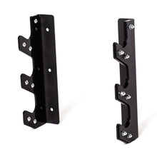 The Bells of Steel 3 Barbell Wall Rack includes two black metal brackets with multiple notched hooks and screws for secure, wall-mounted barbell storage, shown upright against a white background.