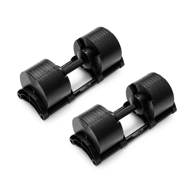 A pair of NÜOBELL Adjustable Dumbbells by Nuobell, in black, features a sliding weight mechanism and knurled handles for a secure grip. Displayed on a white background, each dumbbell showcases a sleek, compact design with durable machined steel plates.