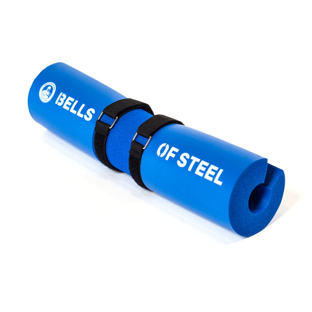 A cushy, ergonomic blue foam barbell pad from Bells of Steel, featuring two black straps for secure attachment and elegant white branding on the sides, stands out among Barbell Pads.