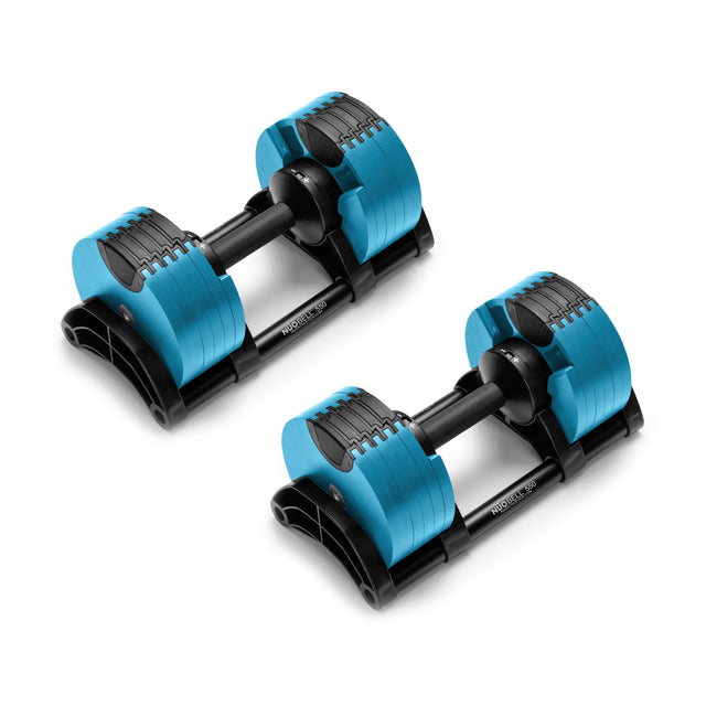 The NÜOBELL Adjustable Dumbbells by Nuobell, featuring machined steel weight plates and black handles, are elegantly displayed side by side on a white background. Their patent-pending design is stabilized on a black stand.