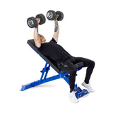 In a gym, someone in a black outfit and white sneakers performs a dumbbell bench press on the Bells of Steel Buzz-Saw Heavy-Duty Adjustable Bench with an impressive 000lb max capacity, lifting two black dumbbells.