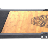 A close-up of the Bells of Steel Deadlift Platform Bamboo Insert (Left), a rectangular bamboo board set in a black frame with metal corner accents and the "BELL" logo partially visible.
