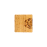 The Deadlift Platform Bamboo Insert (Left) by Bells of Steel is a square cutting board with a partial "BELL STEE" logo on the right side, showcased on a white background and designed for seamless use with modular platforms.