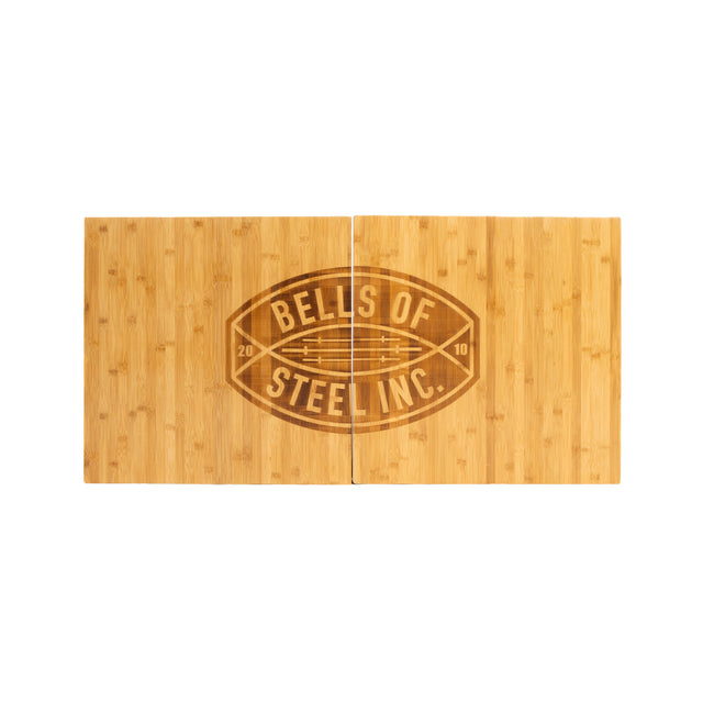 Two rectangular Deadlift Platform Bamboo Inserts by Bells of Steel, engraved with the company logo in the center, form a football shape—perfect as a durable bamboo insert for your lifting platform.