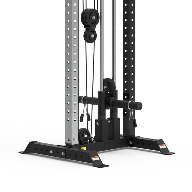 Close-up of the Bells of Steel Cable Tower in a gym. It features metal rods, adjustable pulleys, and multiple attachments for weight training exercises. The sturdy frame has adjustable handles and sports a sleek black and silver finish.