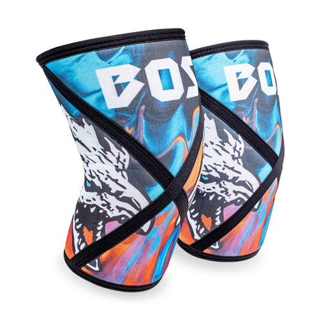 Bells of Steel Knee Sleeves feature bold, colorful abstract blue and orange patterns with a white animal graphic and the partial word "BOSS" at the top, offering added squat support.