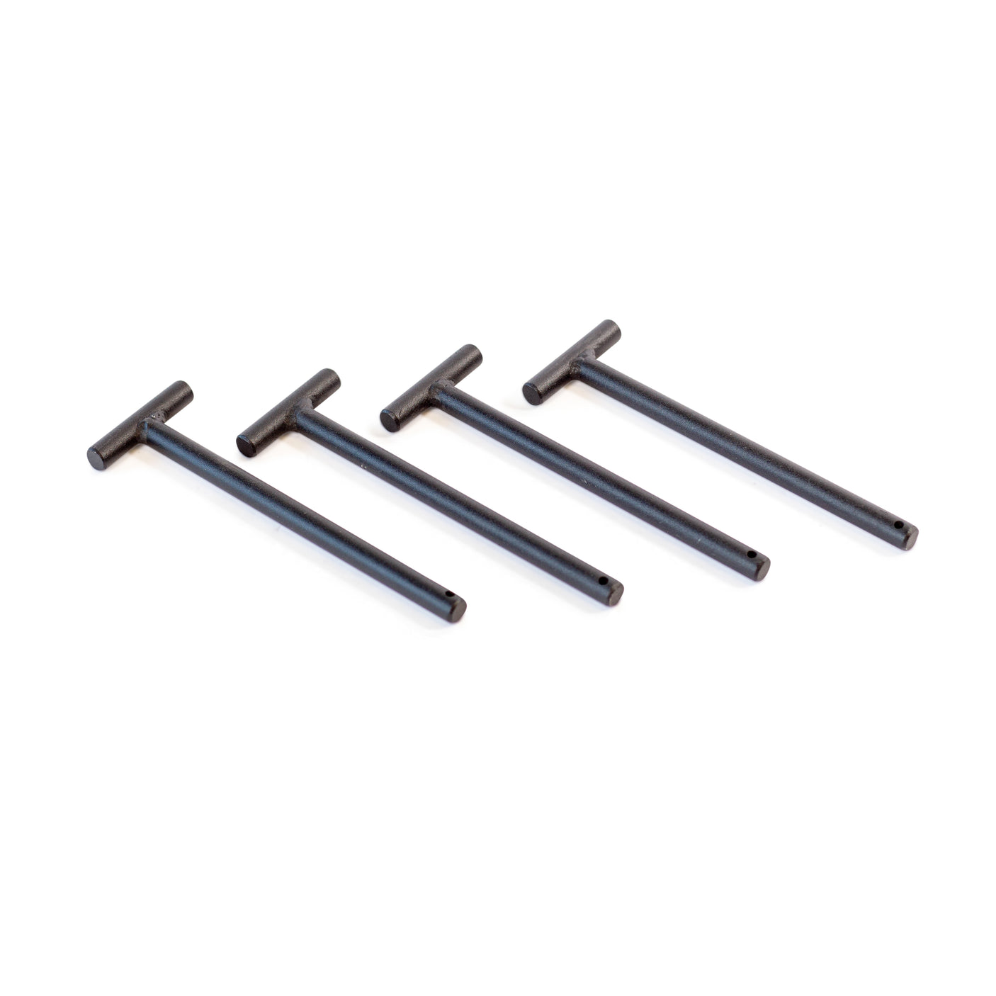 Four Standard Band Pegs by Bells of Steel are lined up diagonally on a white background—ideal for attaching resistance bands to your power rack.