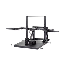 The Bells of Steel Belt Squat Machine is a black metal unit with a large platform, adjustable arms, and a chain with belt for lower body training at home. Shown against a white background.