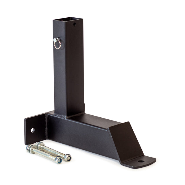 The Bells of Steel Bench Attachments, featuring a pin and two bolts on a black metal bracket with a vertical rectangular tube and flat base, are designed for secure attachment. Ideal for construction or structural uses, they can also serve as leg extensions for added versatility.