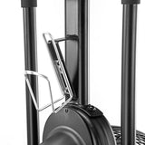 Close-up of a metal water bottle holder mounted on the frame of the Bells of Steel Blitz Air Bike, a black air bike featured in a home gym setup with a white background.